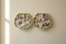 Load image into Gallery viewer, Vintage 1950s Japan Bisque Porcelain Boy Girl Wall Plaques Applied Flowers Pair
