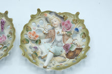 Load image into Gallery viewer, Vintage 1950s Japan Bisque Porcelain Boy Girl Wall Plaques Applied Flowers Pair
