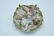 Load image into Gallery viewer, Vintage 1950s Japan Bisque Porcelain Boy Girl Wall Plaques Applied Flowers Pair
