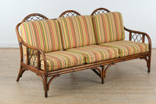 Load image into Gallery viewer, Rattan Sofa with Bright Striped Upholstery and Matching Accent Pillows
