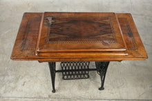 Load image into Gallery viewer, Antique Treadle Sewing Machine in Inlaid Wood Cabinet
