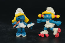 Load image into Gallery viewer, Vintage Smurfette Figures – 1983 &amp; 1984 Schleich Peyo – Artist &amp; Roller Skater
