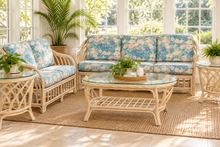 Load image into Gallery viewer, Vintage Rattan Four-Piece Living Room Set with Floral Upholstery and Glass Tables
