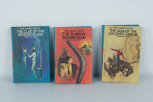 Load image into Gallery viewer, Hardy Boys Mystery Stories Lot (3 Hardcovers, 1970s Editions) – The Clue of the Broken Blade, The Bombay Boomerang, The Sign of the Crooked Arrow
