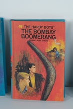 Load image into Gallery viewer, Hardy Boys Mystery Stories Lot (3 Hardcovers, 1970s Editions) – The Clue of the Broken Blade, The Bombay Boomerang, The Sign of the Crooked Arrow
