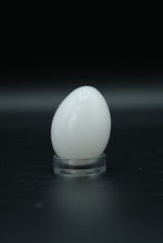 Load image into Gallery viewer, Polished Onyx Stone Egg with Stand – Natural Cream &amp; Amber Tones
