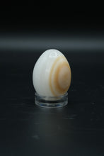 Load image into Gallery viewer, Polished Onyx Stone Egg with Stand – Natural Cream &amp; Amber Tones
