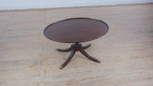 Load and play video in Gallery viewer, Brandt Mahogany Oval Coffee Table with Claw Feet
