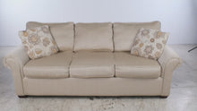 Load and play video in Gallery viewer, KFI Golden Wheat Upholstered 3-Seat Sofa with Rolled Arms &amp; Floral Accent Pillows
