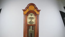 Load and play video in Gallery viewer, Howard Miller Triple Chime Grandfather Clock with Moving Moon Dial
