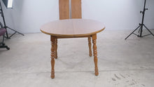 Load and play video in Gallery viewer, Cochrane Furniture Round Oak Extendable Dining Table with 2 Leaves
