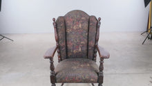 Load and play video in Gallery viewer, Mayhew Antique Carved Oak Wingback Armchair with Tapestry Upholstery and Casters
