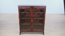 Load and play video in Gallery viewer, Antique Flamed Mahogany Library Display Cabinet with Fretwork Glass Doors – 37”
