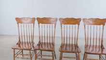 Load and play video in Gallery viewer, Set of Four Vintage Carved Oak Pressed Back Spindle Dining Chairs
