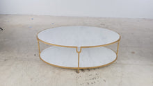 Load and play video in Gallery viewer, Global Views Iron and Stone Oval Two-Tier Coffee Table in Gold Finish
