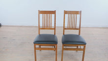Load and play video in Gallery viewer, Set of 2 Stakmore Fruitwood Folding Dining Chairs Black Vinyl Seats
