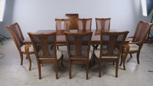 Load and play video in Gallery viewer, Thomasville Solid Wood Dining Table with 8 Cane Back Chairs and 2 Leaves
