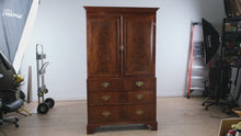 Load and play video in Gallery viewer, 19th Century English Mahogany Linen Press Armoire with Flame Veneer Panels
