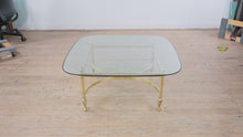 Load and play video in Gallery viewer, Hollywood Regency Brass Coffee Table with Glass Top and Claw Feet
