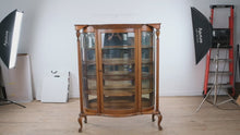 Load and play video in Gallery viewer, Antique Tiger Oak Curved Glass Curio Cabinet with Leaded Glass and Claw Feet

