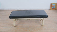 Load and play video in Gallery viewer, Vintage Black Vinyl Upholstered Bench with Velvet Cloak Raleigh NC Crest and Painted Wood Base
