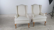 Load and play video in Gallery viewer, Pair of Traditional Wingback Lounge Chairs in Ivory Upholstery with Queen Anne Legs
