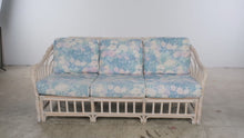 Load and play video in Gallery viewer, Vintage Rattan Four-Piece Living Room Set with Floral Upholstery and Glass Tables
