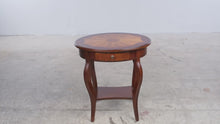 Load and play video in Gallery viewer, Butler Specialty Jeanette Plantation Cherry Oval Accent Table with Sunburst Inlay
