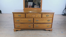 Load and play video in Gallery viewer, Spindle Forest Oak 7-Drawer Dresser - Bassett
