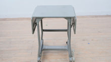 Load and play video in Gallery viewer, Vintage Industrial Metal Drop Leaf Rolling Table with Foot Brake
