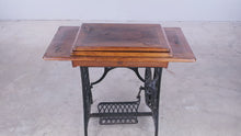 Load and play video in Gallery viewer, Antique Treadle Sewing Machine in Inlaid Wood Cabinet
