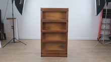 Load and play video in Gallery viewer, Antique 4-Stack Tiger Oak Barrister Bookcase with Lower Drawer (c. 1890–1910)
