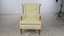Load and play video in Gallery viewer, Vintage Traditional Wingback Lounge Chair Yellow Upholstery Carved Wood 39 Inch
