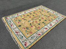 Load image into Gallery viewer, Woven Golden Rug with Floral Design
