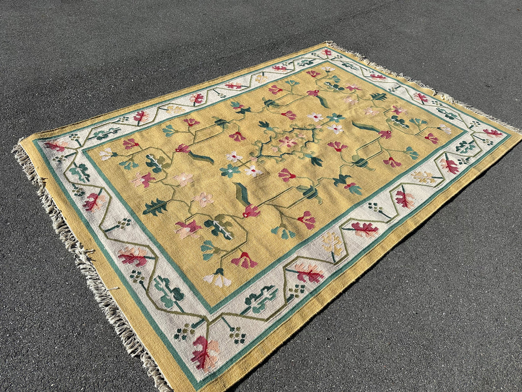Woven Golden Rug with Floral Design